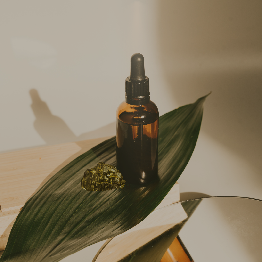Image of Magnet oil on a green leaf; made by Tashiana The SunGoddess