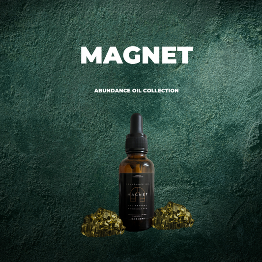 “Magnet” image of 1 bottle of abundance oil and 2 pyrite stones. Handmade Oil
Made by Tashiana The Sun Goddess. Against an emerald green background. 