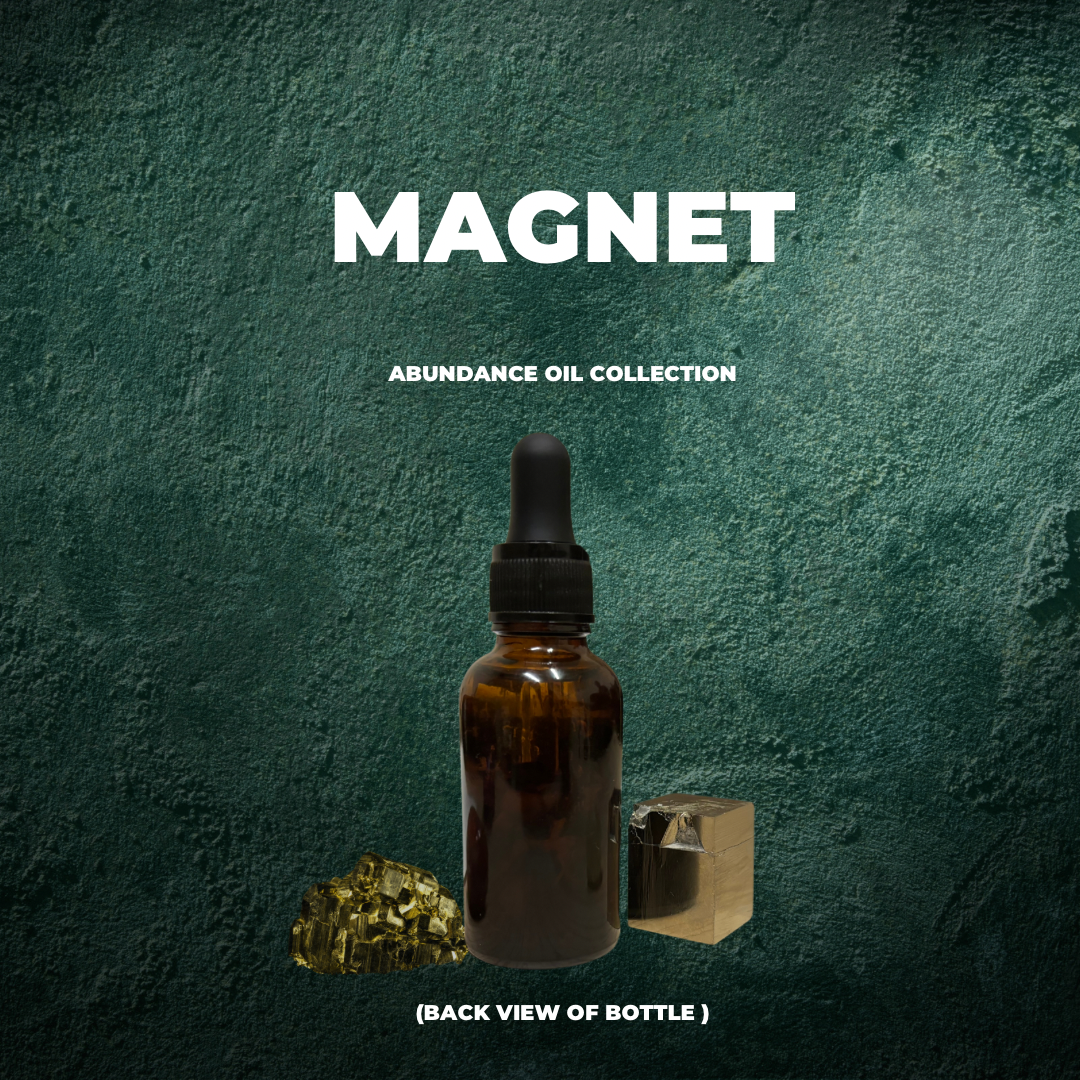 “Magnet” image of 1 bottle of the back of a bottle of abundance oil and 2 pyrite stones. Handmade Oil
Made by Tashiana The Sun Goddess. Against an emerald green background. 